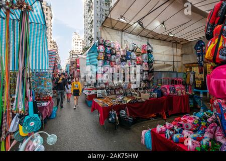 HongKong, China - November, 2019: Fashion, clothing and merchandise on street market (Ladie`s Market) in Hong Kong , Tung Choi Street Stock Photo